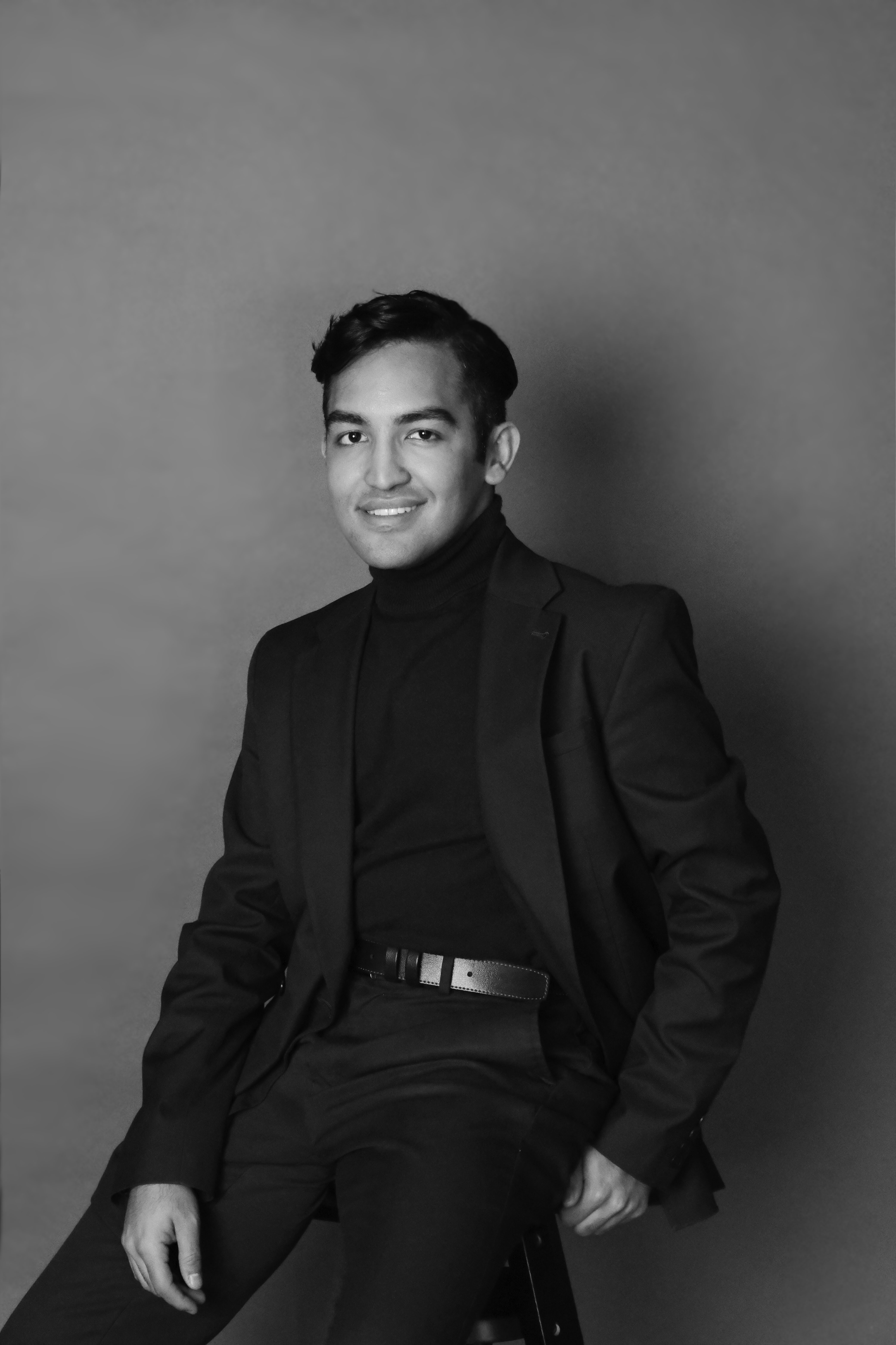 Black and white portrait of a man in formal attire